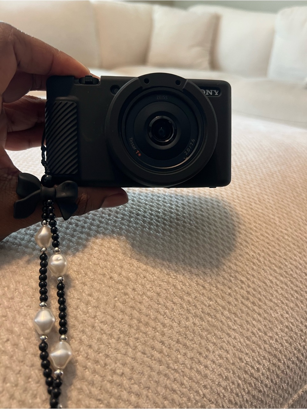 Sony Black Compact Point-and-Shoot Camera with Attached Beaded Strap